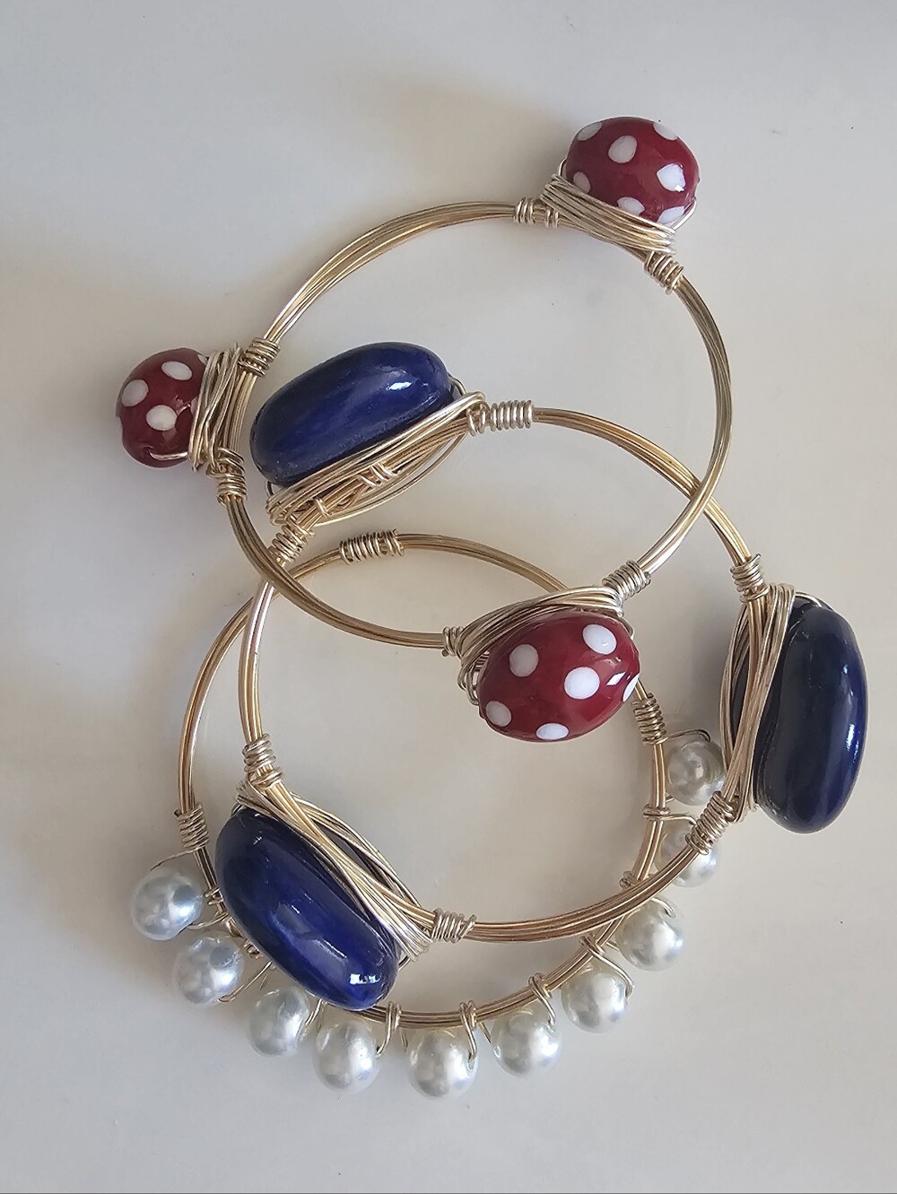 Handmade Gold-Tone Wire Bangle Set with Blue Beads and Red Polka Dot Accents